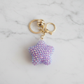 Porte-clé étoile sur marbre blanc